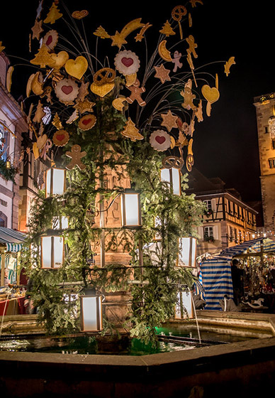 Medieval Christmas market of Ribeauvillé with illuminated half-timbered houses and festive stalls